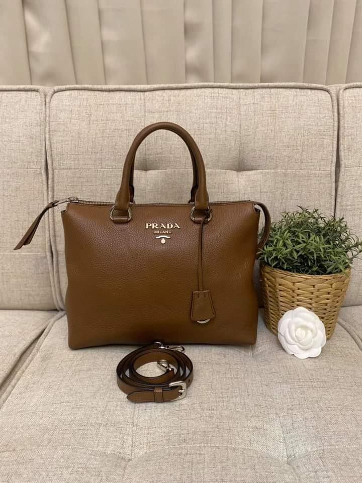 Prada Vitello Phenix 2-way bag (Category: Luxury Bags & Wallets) located in Manila. Submitted by bagislifeshop (Listing ID 1115440206, Image 1). Description: Prada Babyyyy!!! 🤎🤎🤎 On Hand in PH🇵🇭 100% Authentic Prada Vitello Phenix 2-Way Bag in Brown Condition: 9/10 Comes with Standard Dustbag and Strap.