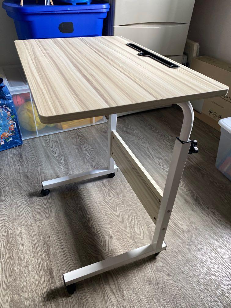 Adjustable Movable Table (Category: Tables & Sets) located in Singapore. Submitted by dar_man (Listing ID 1115528105, Image 3). Description: Great to use as a mobile workdesk!.