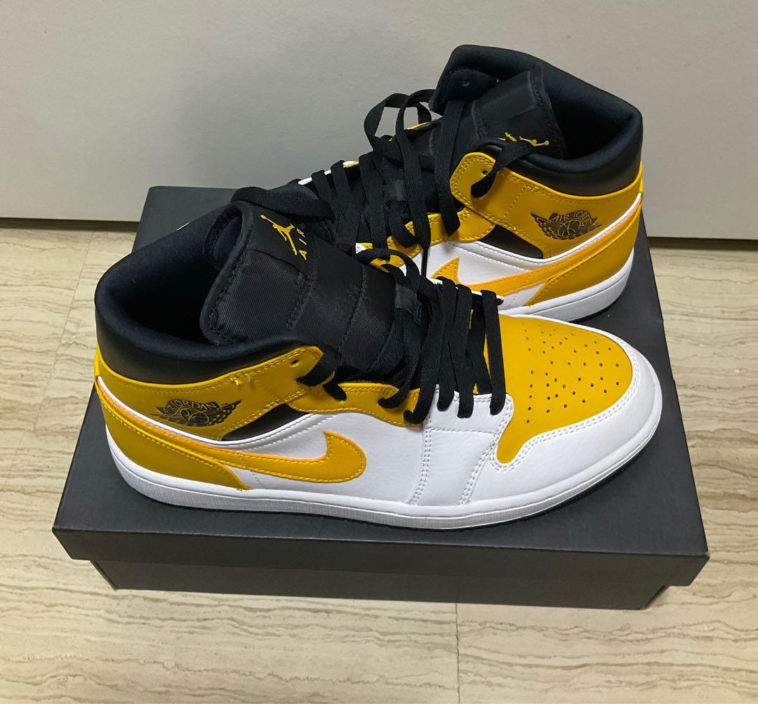 air jordan 1 mid university gold on feet