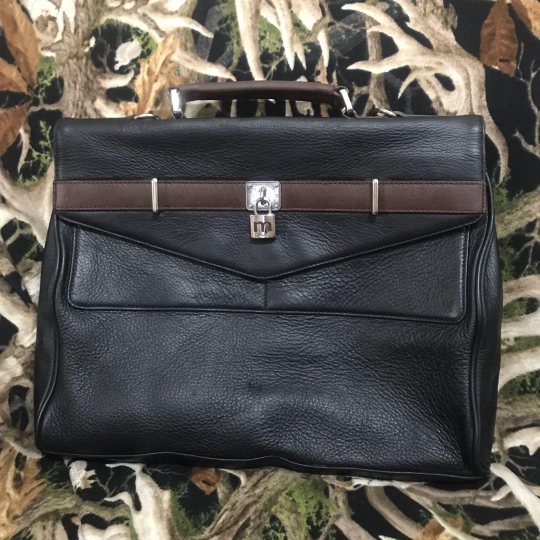 Mook Laptop Document Bag (Category: Briefcases) located in Manila. Submitted by shopaholic_gurl (Listing ID 1115723748, Image 1). Description: In excellent used condition No sling Multiple compartment approximately measure 17x14in sold exactly as seen in pics all pics posted Genuine leather with serial code.