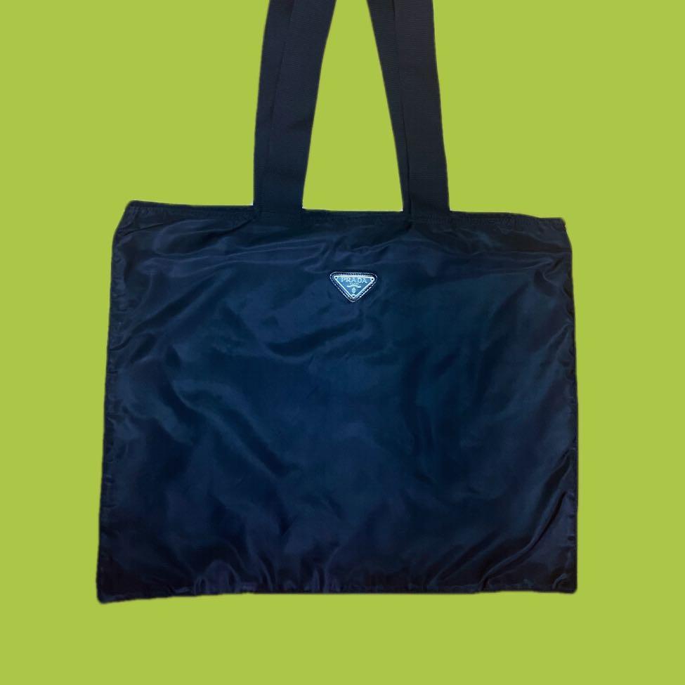 PRADA NYLON DOCUMENT SHOULDER BAG (Category: Luxury Bags & Wallets) located in Quezon City. Submitted by najamazing (Listing ID 1115791503, Image 1). Description: PRADA NYLON DOCUMENT TOTE BAG Material: Nylon Inclusion: None Size: L 19” x H 15” x Strap 13” Rank: A Price: Php8,000.