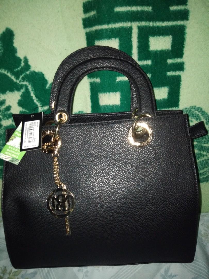 Badgley Mischka Hand and Sling Bag (Category: Luxury Bags & Wallets) located in Romblon. Submitted by migustyles (Listing ID 1115979351, Image 1). Description: Badgley Mischka Hand and Sling Bag Vegan Leather Black Brandnew and Authentic Bought in USA.