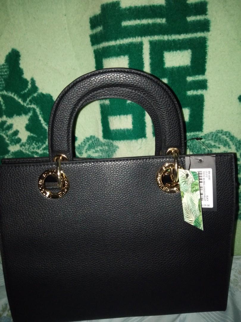 Badgley Mischka Hand and Sling Bag (Category: Luxury Bags & Wallets) located in Romblon. Submitted by migustyles (Listing ID 1115979351, Image 2). Description: Badgley Mischka Hand and Sling Bag Vegan Leather Black Brandnew and Authentic Bought in USA.