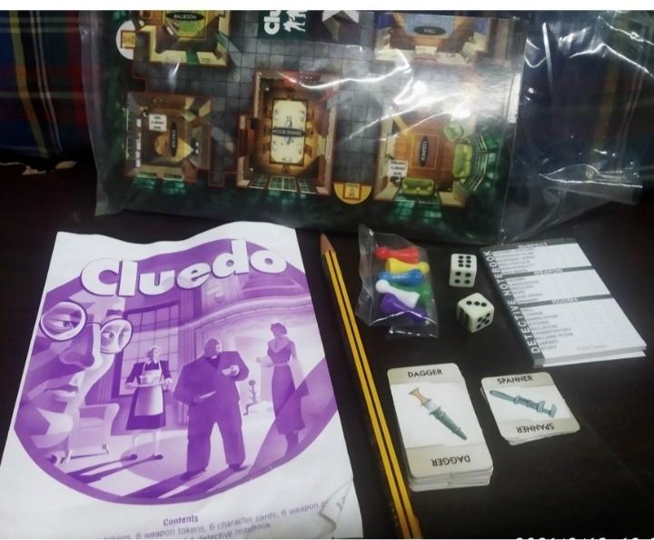 CLUEDO TRAVEL EDITION (Category: Board Games & Puzzles) located in Marikina City. Submitted by mightydeer_1c3906 (Listing ID 1116234090, Image 3). Description: 1. COMPLETE 2. Classic Cluedo board game in a handy, compact, portable version. 3. Good used condition. 4. Set includes all parts comprising of Plastic case/board 6 board counters, weapon cards, character cards, 9 room cards, 2 dice, 1 detective note book and game instructions. 5. Light we