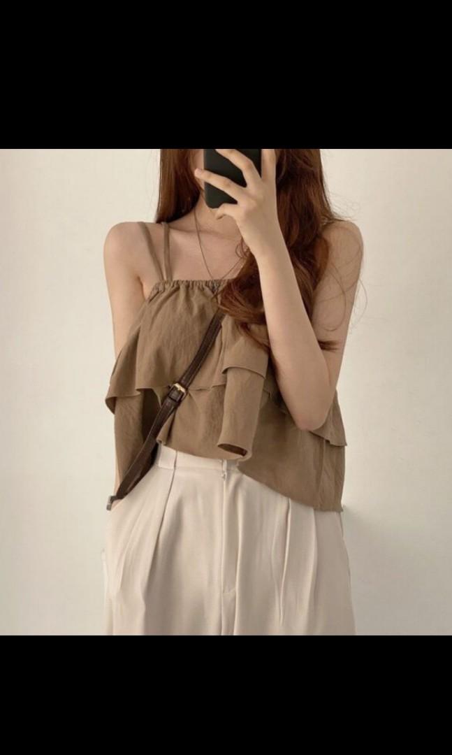 White flutter top (Category: Sleeveless) located in Singapore. Submitted by a.wbing (Listing ID 1116303821, Image 3). Description: white colour, worn once doesnt look good on me thus selling.
