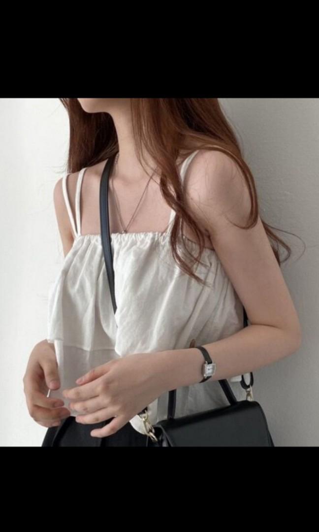 White flutter top (Category: Sleeveless) located in Singapore. Submitted by a.wbing (Listing ID 1116303821, Image 1). Description: white colour, worn once doesnt look good on me thus selling.