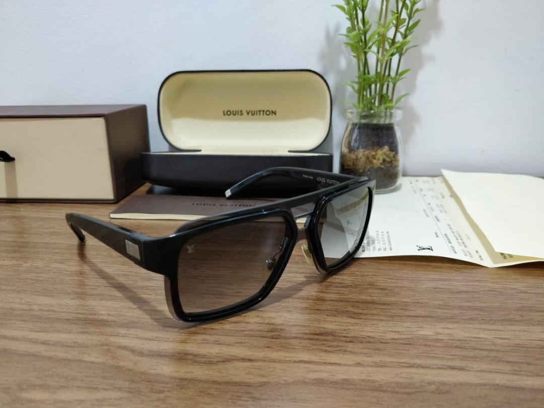 Louis Vuitton A Pair Of Black Enigme Sunglasses.