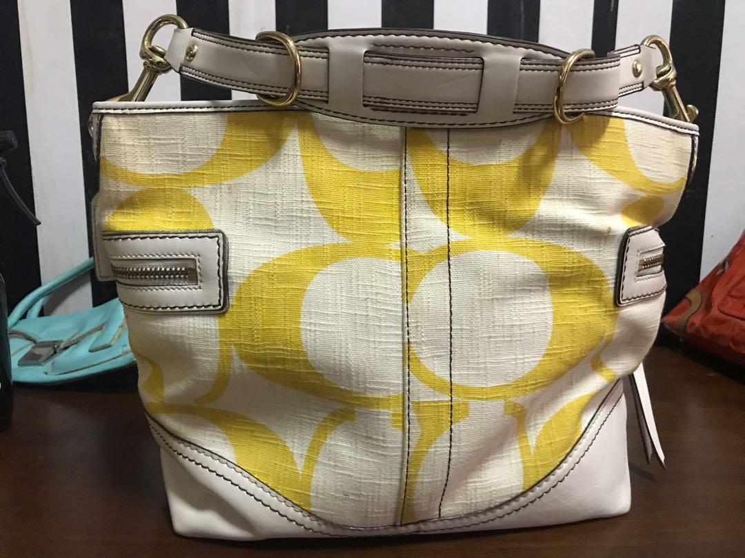 yellow and white coach purse