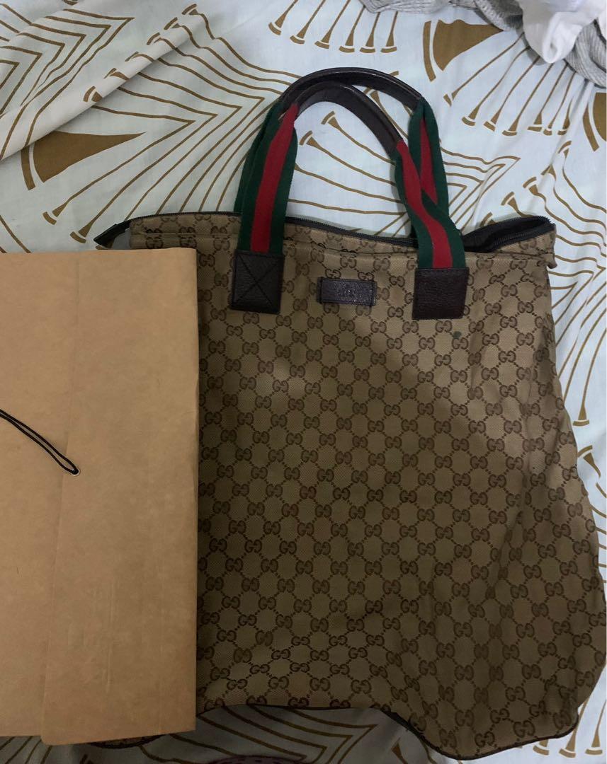 Gucci Nylon Tote Bag (Category: Luxury Bags & Wallets) located in Mandaluyong City. Submitted by dij.garcia (Listing ID 1111819619, Image 2). Description: Bought in Japan thrift store. Needs cleaning. Long brown envelope is for size reference. .