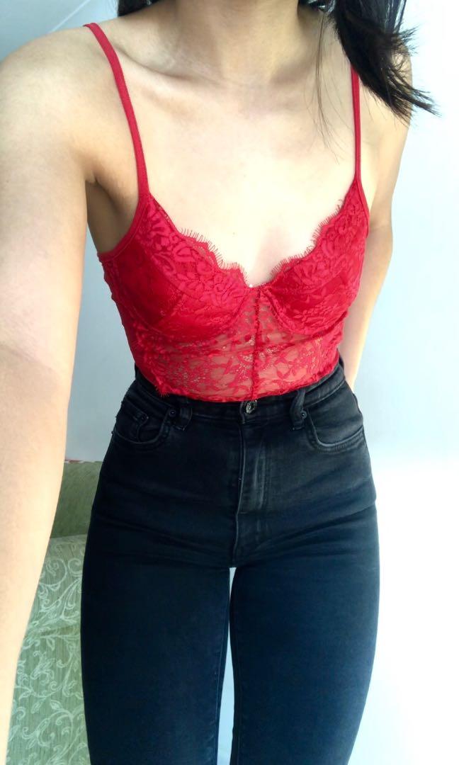 Red lace bodysuit and black jeans