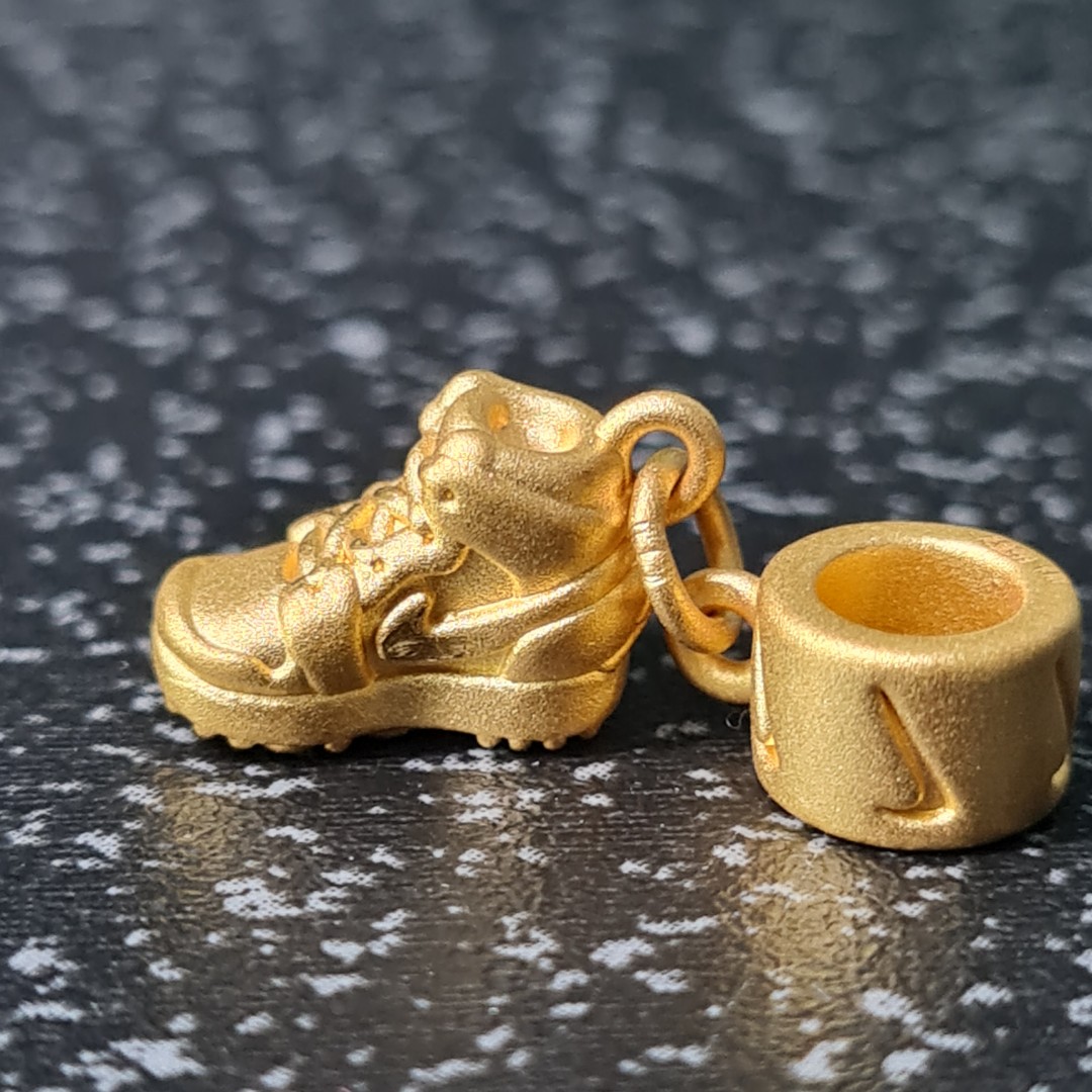 Gold nike top charm
