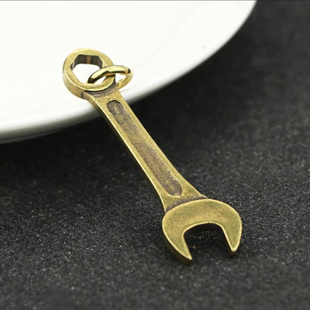 Gold outlet wrench pendant
