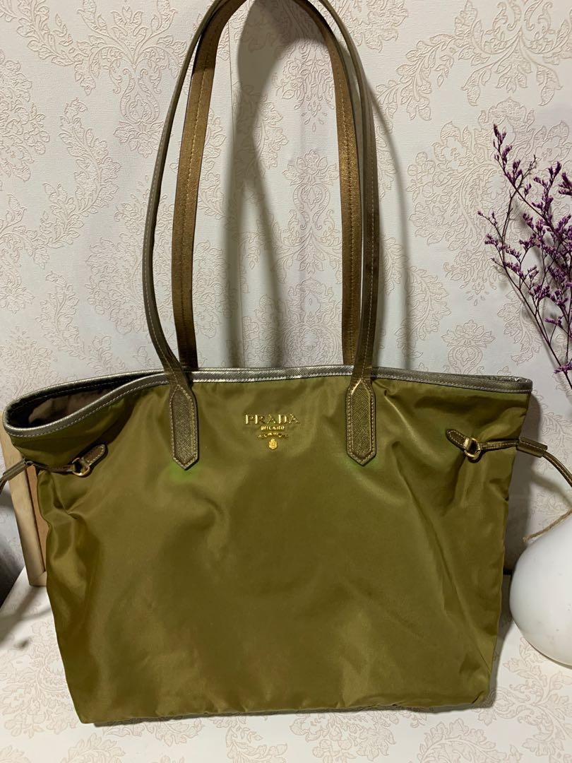 Authentic Preloved Prada tote (Category: Luxury Bags & Wallets) located in Pasig City. Submitted by wandererme (Listing ID 1112448934, Image 2). Description: Authentic preloved prada tote in marine green color, nylon material no corner rubs Flaws - some discoloration due to sun exposure and span of time , others as seen in the photos 💯 original Pls message me for more details :) .