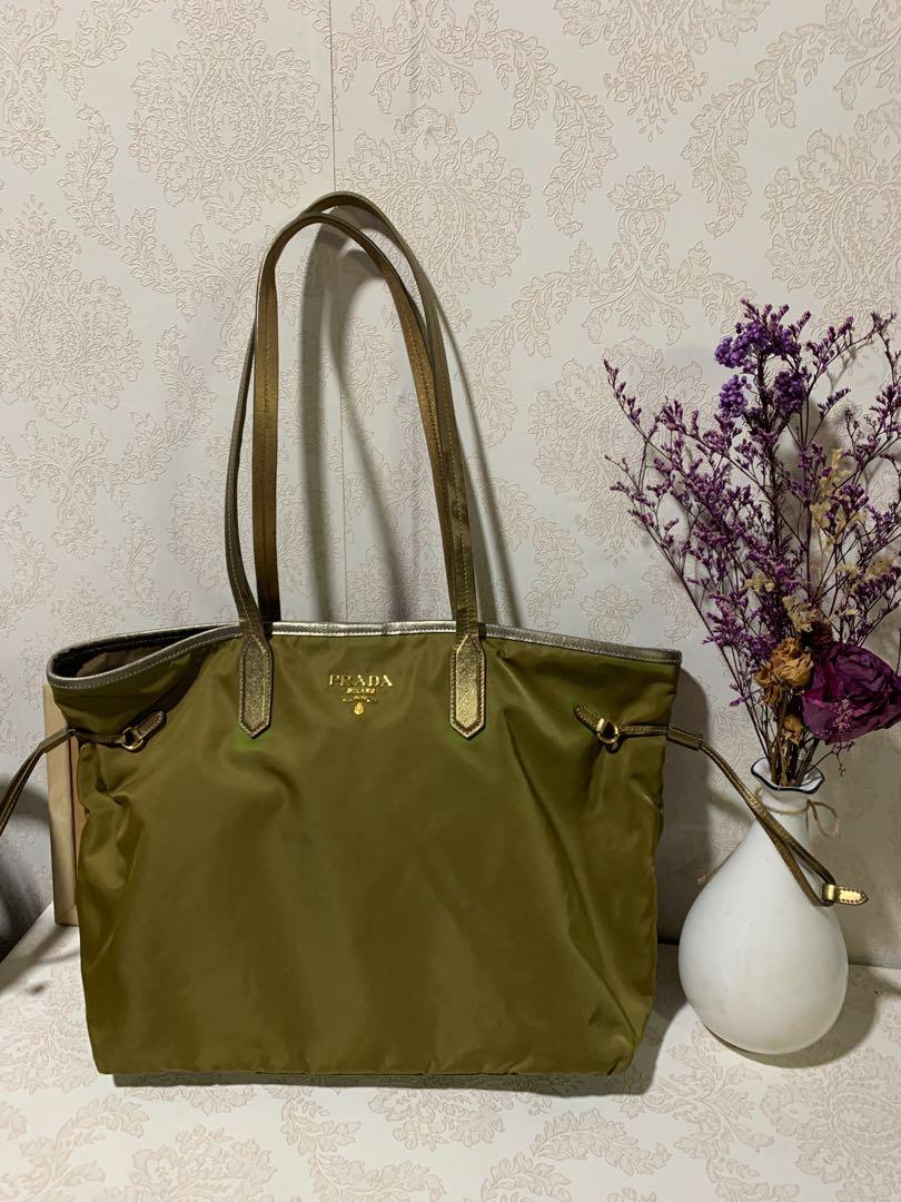 Authentic Preloved Prada tote (Category: Luxury Bags & Wallets) located in Pasig City. Submitted by wandererme (Listing ID 1112448934, Image 1). Description: Authentic preloved prada tote in marine green color, nylon material no corner rubs Flaws - some discoloration due to sun exposure and span of time , others as seen in the photos 💯 original Pls message me for more details :) .