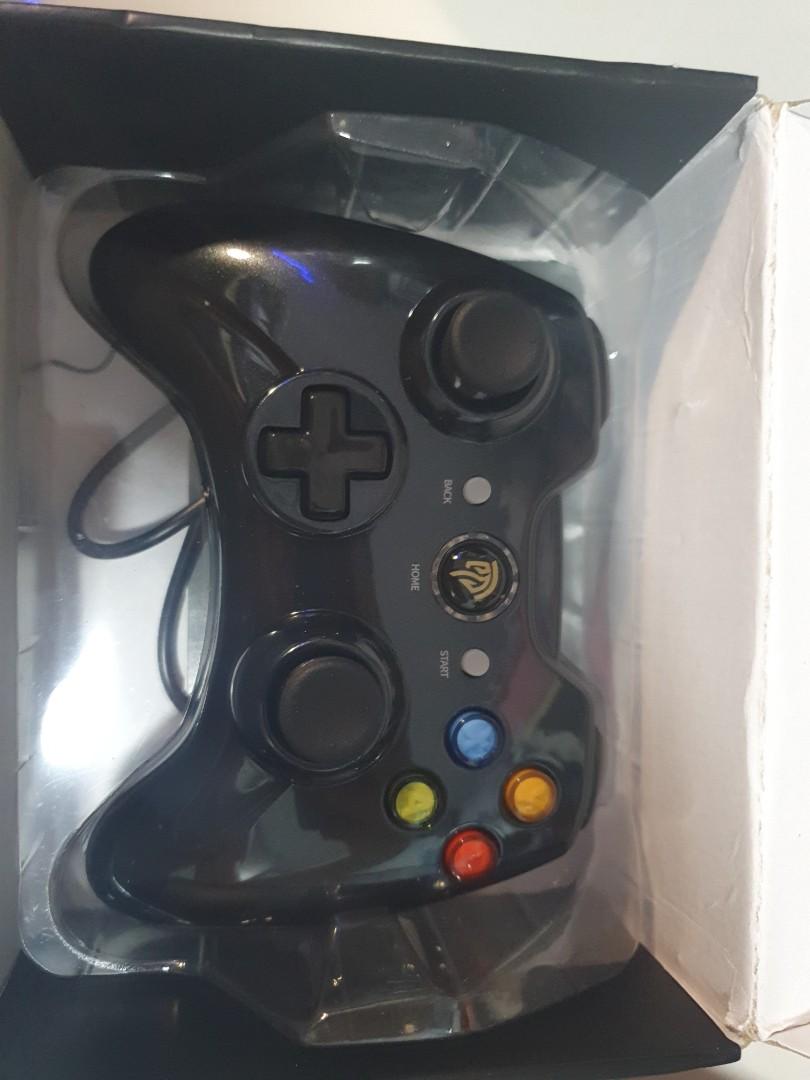 Gaming controller (Category: Xbox) located in Singapore. Submitted by onelettershor (Listing ID 1112470479, Image 1). Description: able to use for xbox or normal computer gaming. brand new with box.