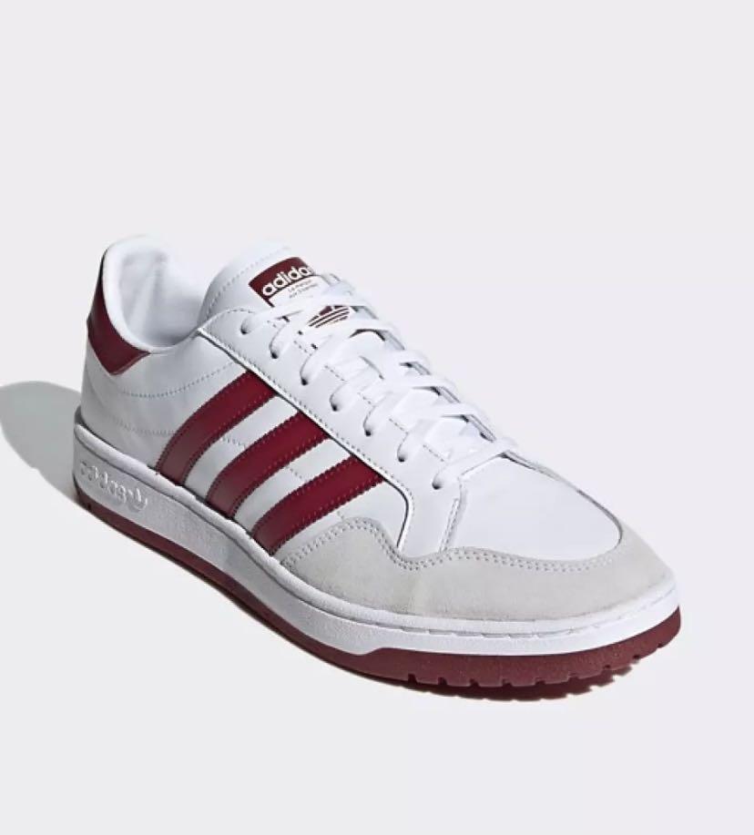 White leather adidas store trainers