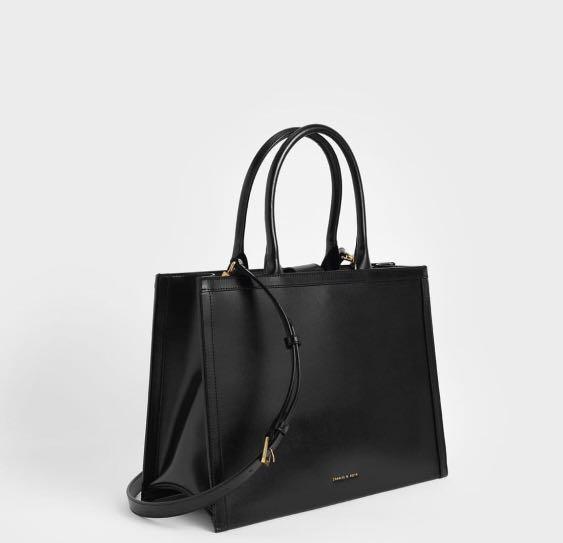 CHARLES AND KEITH LARGE TOTE BAG BLACK (Category: Luxury Bags & Wallets) located in Manila. Submitted by toughavenuesg (Listing ID 1112641676, Image 2). Description: 💯 ORIGINAL NEW INCLUDES ALL: DUST BAG PAPER BAG CARDS COLOR: BLACK CAN FIT LAPTOP 💻 Cheaper than store price!!!.