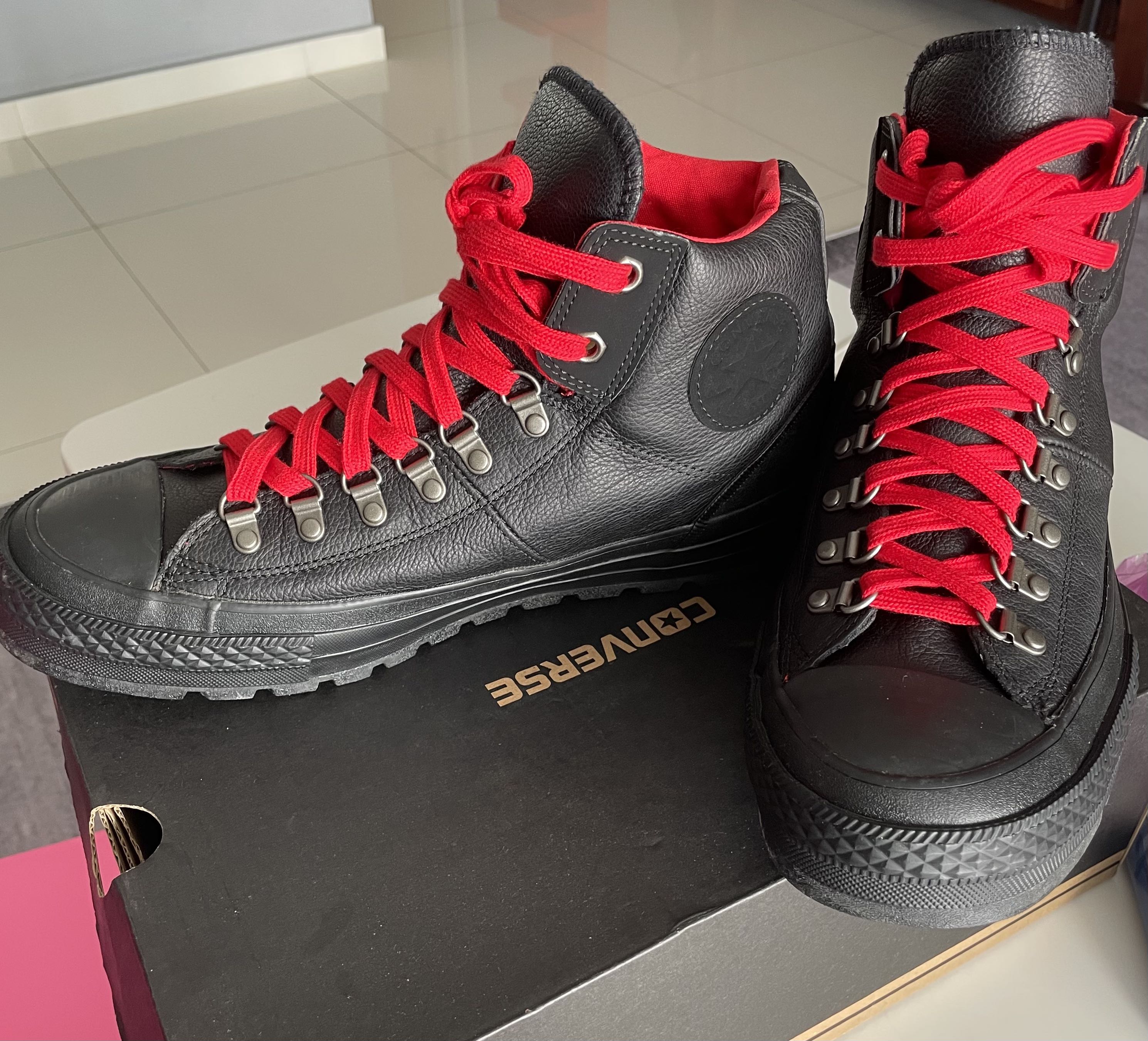 Red leather hotsell high top converse