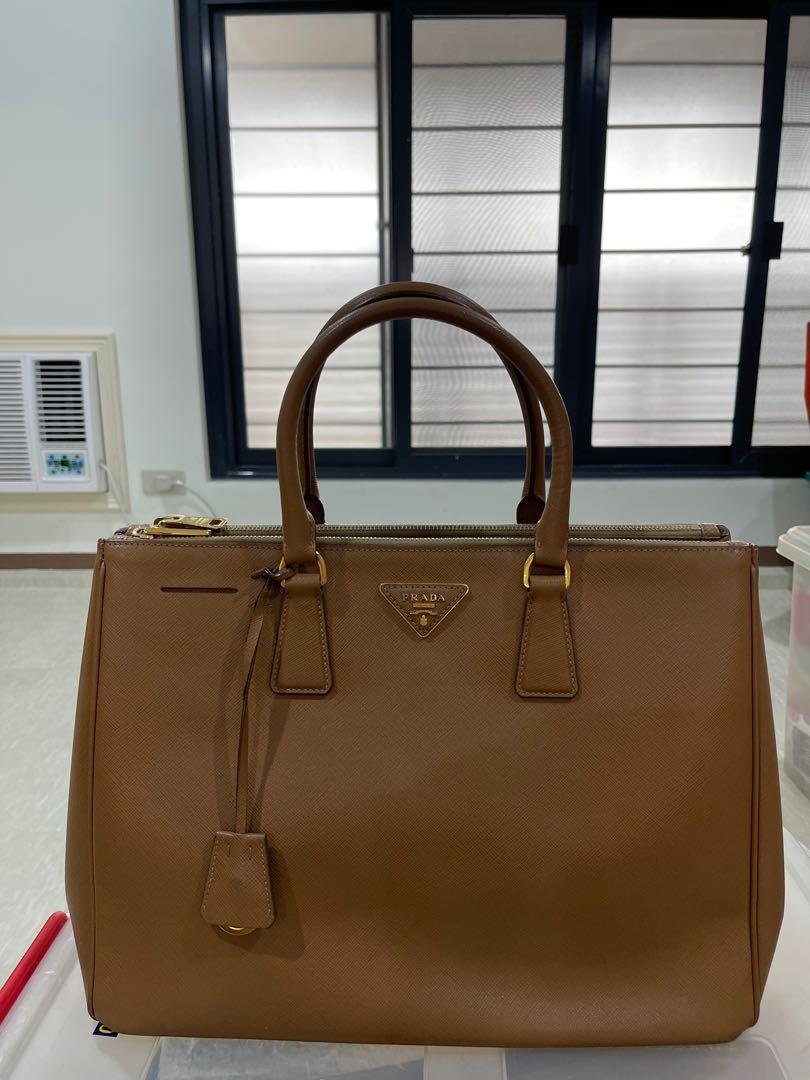 Prada Galleria Saffiano Large Tote (Category: Luxury Bags & Wallets) located in Quezon City. Submitted by envti (Listing ID 1136745420, Image 1). Description: Perfect Office Bag! Well used so needs cleaning, left button is a little loose, pm for more pics Bought for almost 125k.