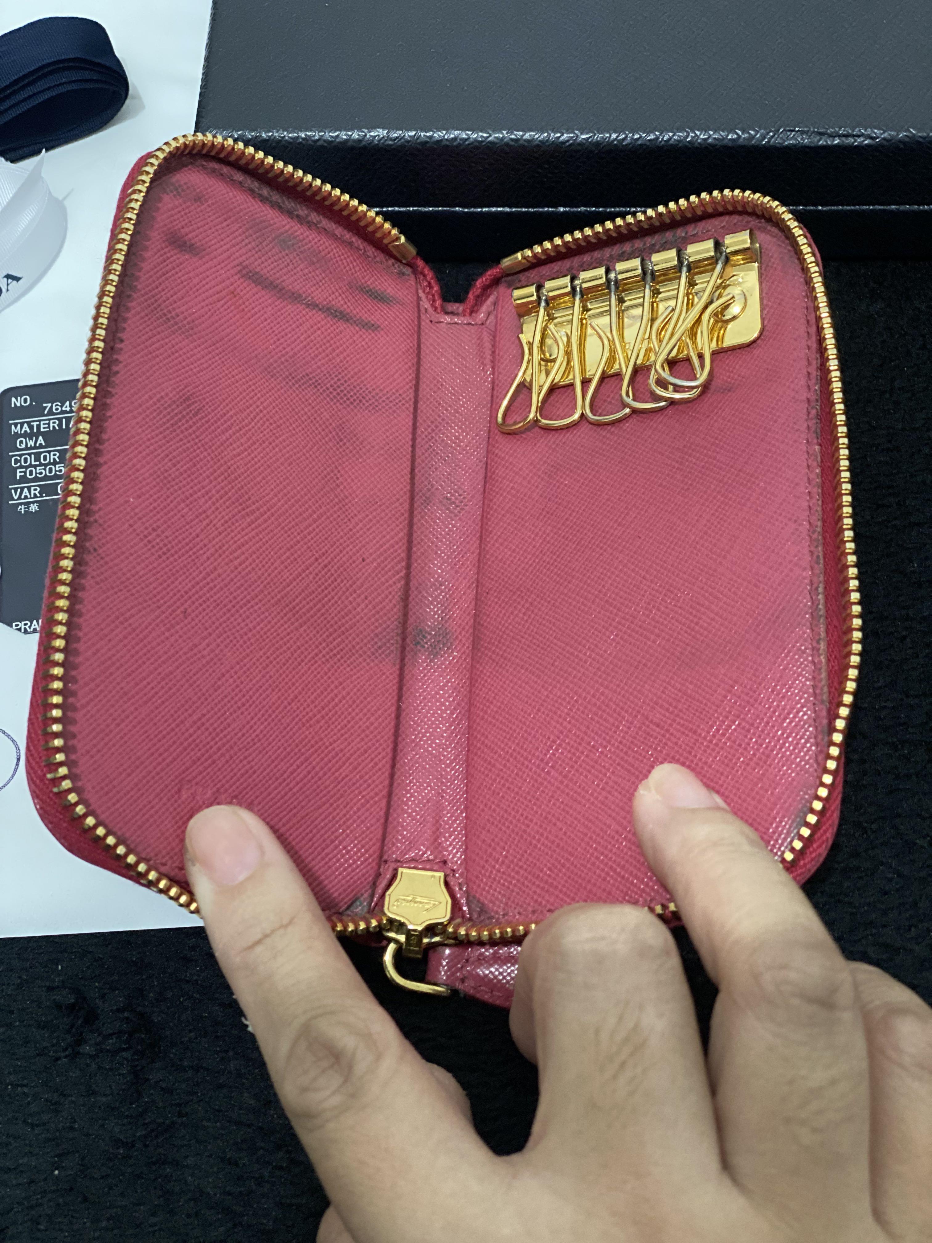 Prada Saffiano Zip 6 Key Case Holder (Category: Luxury Bags & Wallets) located in Paranaque City. Submitted by sillybella (Listing ID 1136727169, Image 2). Description: Original PRADA Saffiano Metal Zip Around 6 Key Holder Peonia (pink) 100% legit | Original Japan purchased (kyoto) Length: 5.5 in Width: 1 in Height: 2.75 in Issue: - dirt inside linisan nyo nlang libag lang yan due to usage Mag Mukhang pa sya bago pag na palinis ung loob. - light 