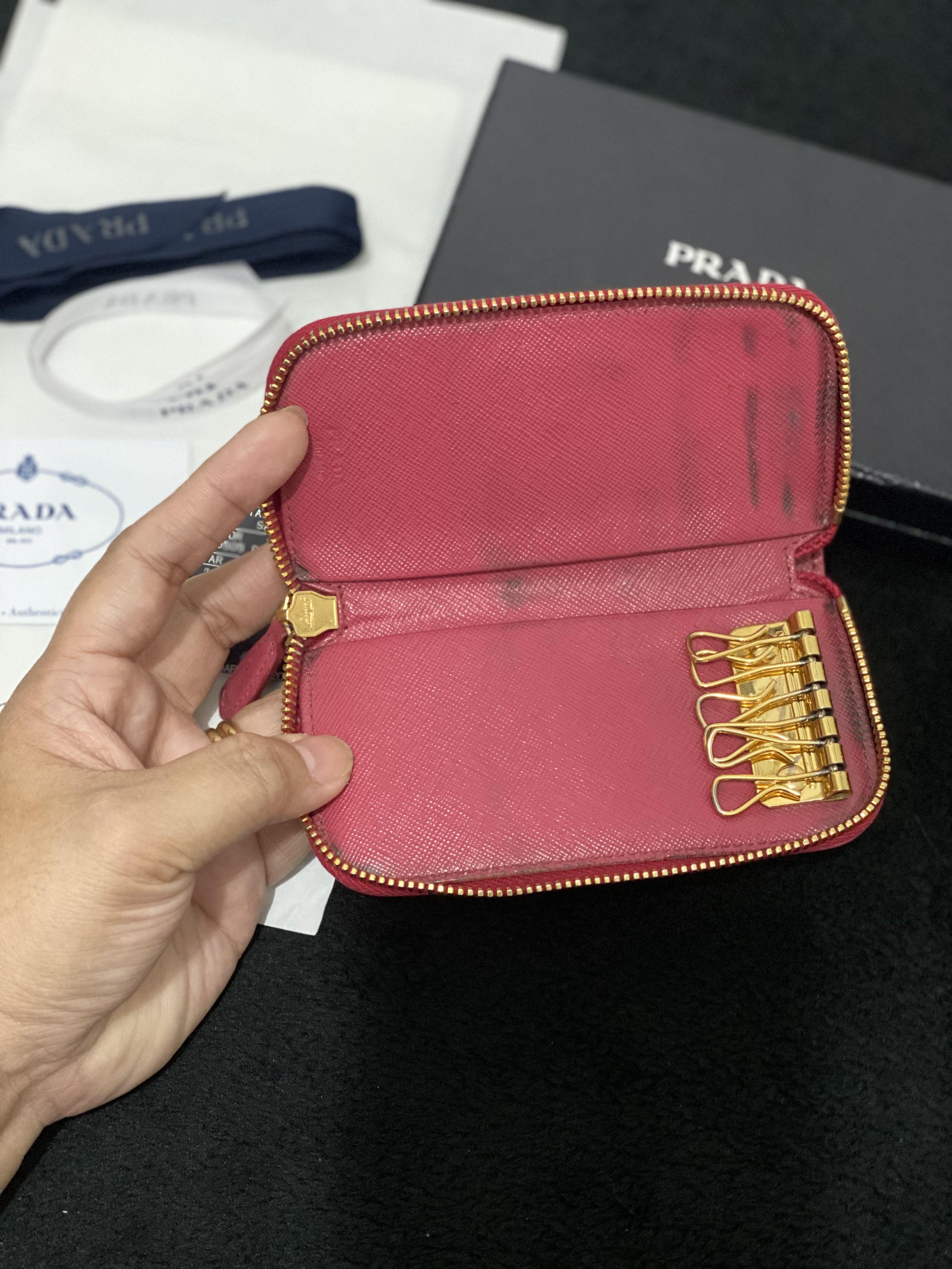 Prada Saffiano Zip 6 Key Case Holder (Category: Luxury Bags & Wallets) located in Paranaque City. Submitted by sillybella (Listing ID 1136727169, Image 3). Description: Original PRADA Saffiano Metal Zip Around 6 Key Holder Peonia (pink) 100% legit | Original Japan purchased (kyoto) Length: 5.5 in Width: 1 in Height: 2.75 in Issue: - dirt inside linisan nyo nlang libag lang yan due to usage Mag Mukhang pa sya bago pag na palinis ung loob. - light 