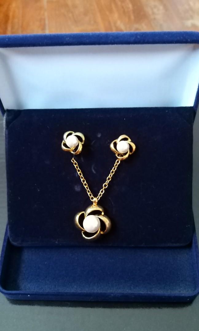 Matching pearl on sale necklace and earrings