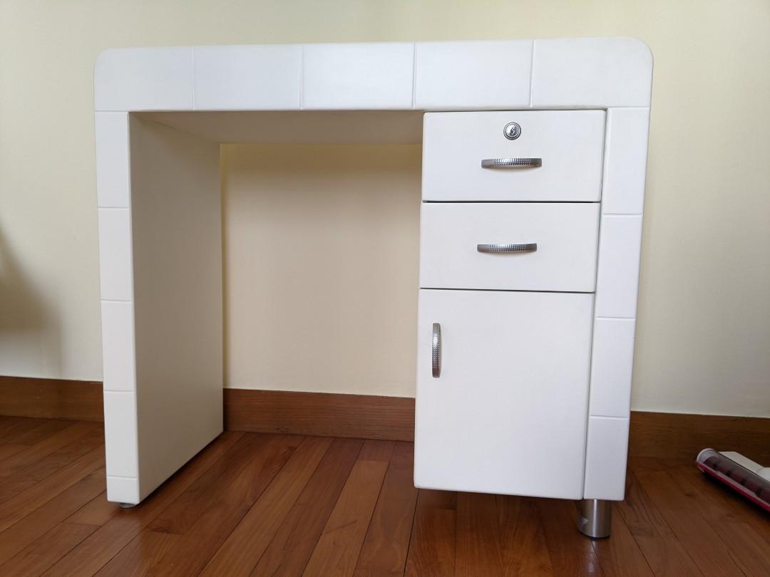 Small desk (Category: Other Home Furniture) located in Singapore. Submitted by dliu22 (Listing ID 1136867236, Image 1). Description: Barely used small desk with rounded ends. Sturdy build, contemporary look. Drawers open and close smoothly. Width: 84cm x Depth: 38cm x Height: 76cm..