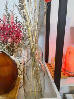 Plain bottle vase with dried flowers