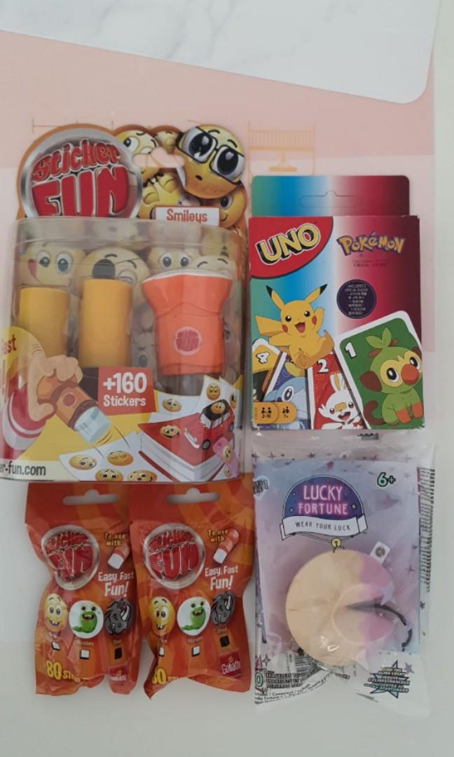 Pokemon UNO cards , fortune cookie toy and Sticker stamper ...