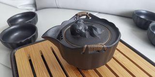 Teapot  and tea cup in ceramic with tea filter and bamboo tea crate and travelling case
