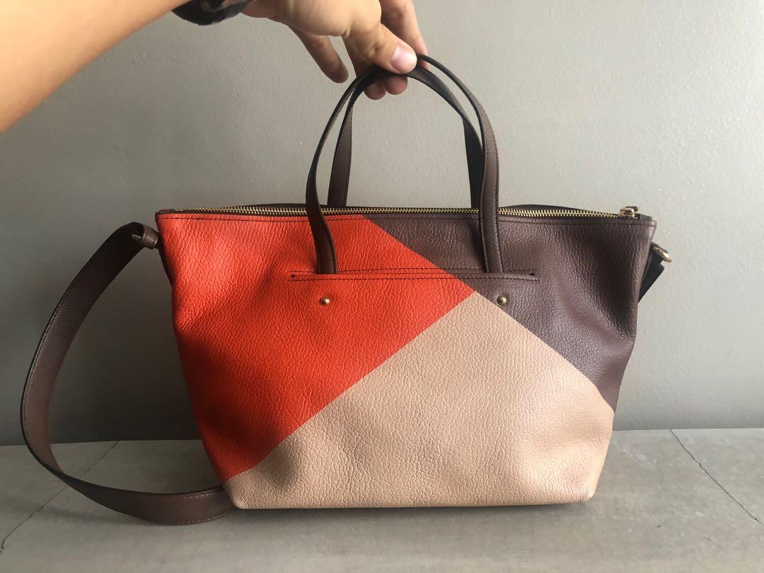 Ferragamo Leather Mika Zip Tote Bag (Category: Luxury Bags & Wallets) located in Quezon City. Submitted by kennesells (Listing ID 1137236444, Image 2). Description: Authentic Made in Italy Salvatore Ferragamo Leather Zip Tote Bag with Strap Brown-Orange-Peach color Magnetic Exterior Pocket Never used Inclusions: tags/cards, dustbag and paperbag Dimensions: 20cm H x 39cm L.