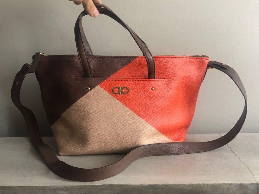 Ferragamo Leather Mika Zip Tote Bag (Category: Luxury Bags & Wallets) located in Quezon City. Submitted by kennesells (Listing ID 1137236444, Image 1). Description: Authentic Made in Italy Salvatore Ferragamo Leather Zip Tote Bag with Strap Brown-Orange-Peach color Magnetic Exterior Pocket Never used Inclusions: tags/cards, dustbag and paperbag Dimensions: 20cm H x 39cm L.
