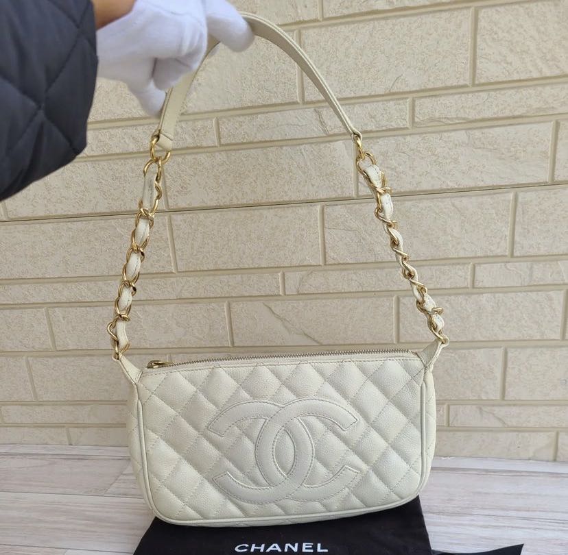 Authentic Chanel Timeless CC Pochette Quilted White Caviar Leather, Luxury,  Bags & Wallets on Carousell