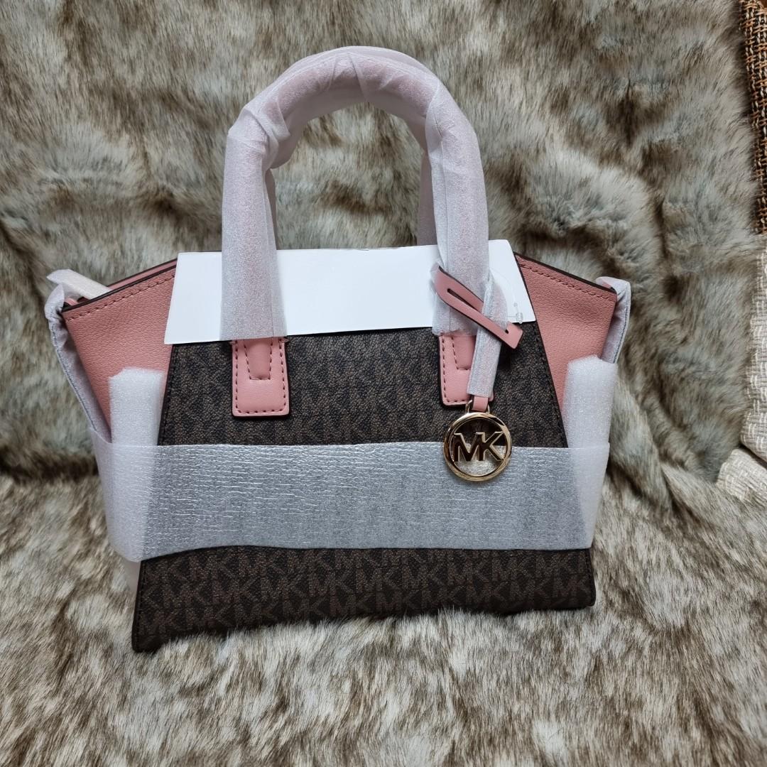 Michael Kors Avril (Category: Luxury Bags & Wallets) located in Malabon City. Submitted by andies.closet (Listing ID 1137911271, Image 2). Description: Authentic Bought from US Money back if proven fake Michael Kors Avril Small Satchel Crossbody * Logo-print canvas *Gold-tone hardware *9.5"W (bottom) X 8"H X 4"D +Exterior details: detachable & adjustable crossbody strap, back slip pockets *adjustable crossbody strap.