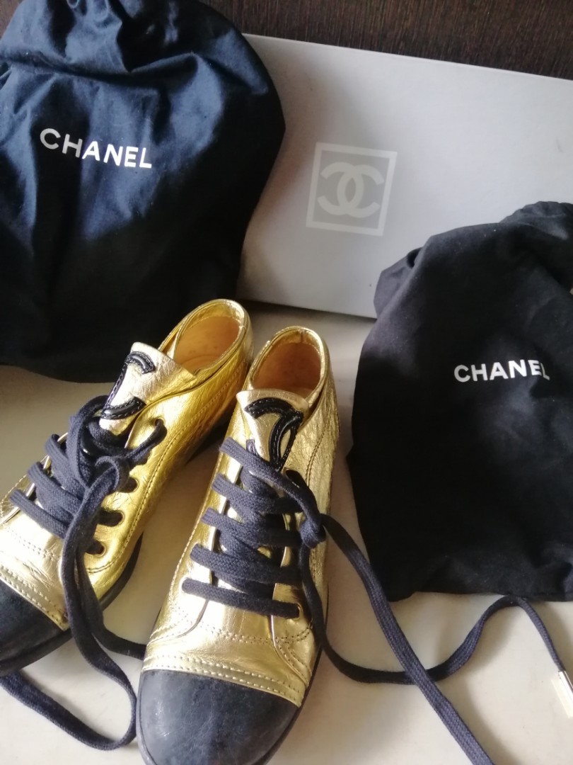 Black and gold chanel sneakers top