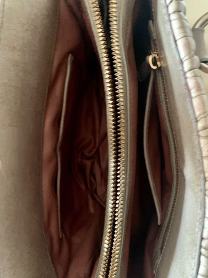 Miu Miu Handbag (Category: Luxury Bags & Wallets) located in Batangas. Submitted by olxph_744406747 (Listing ID 1138030163, Image 3). Description: Preloved Miu Miu Handbag, quilted, heavily used but still okay, no strap included but you can put extra strap, inner of the bag is still great! .