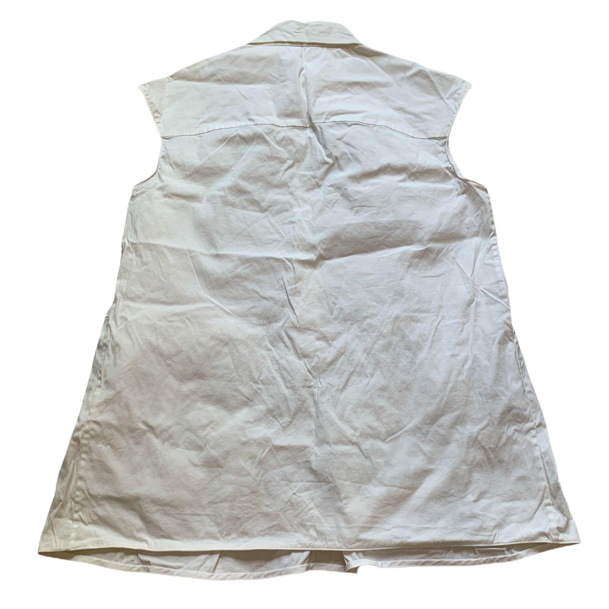 Prada Tops (Category: Sleeveless) located in Singapore. Submitted by xiadaowo (Listing ID 1138216708, Image 7). Description: Prada sleeveless top $150 authentic, good condition Measurements (+/- 1 inch): Ptp: 15 Length: 22.8 Prada sleeveless top with tie detail $150 authentic, good condition Measurements (+/- 1 inch): Ptp: 16.5 Length: 23.8 Registered mail: $5.