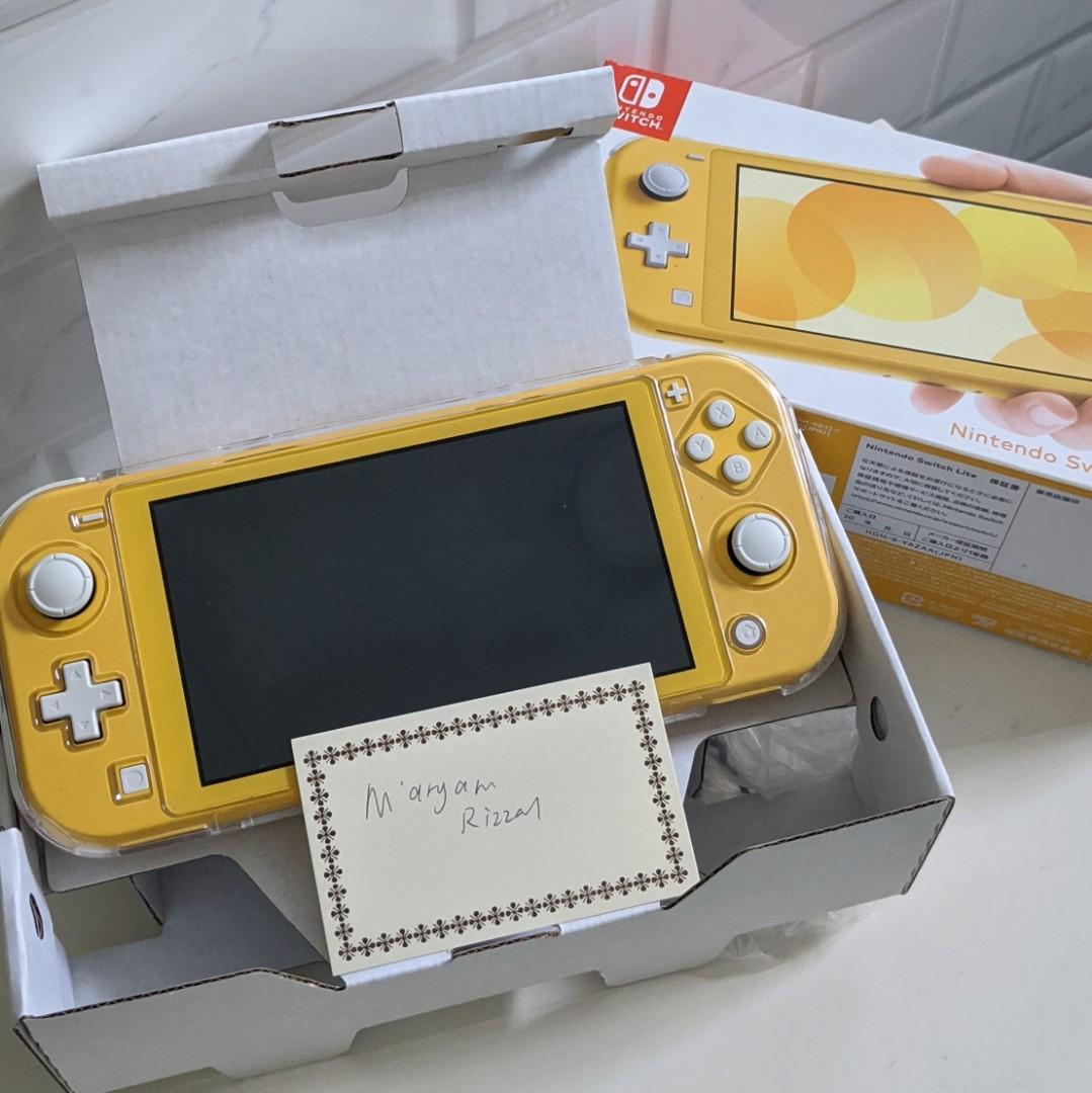 WTS NINTENDO SWITCH LITE YELLOW with digital games Animal