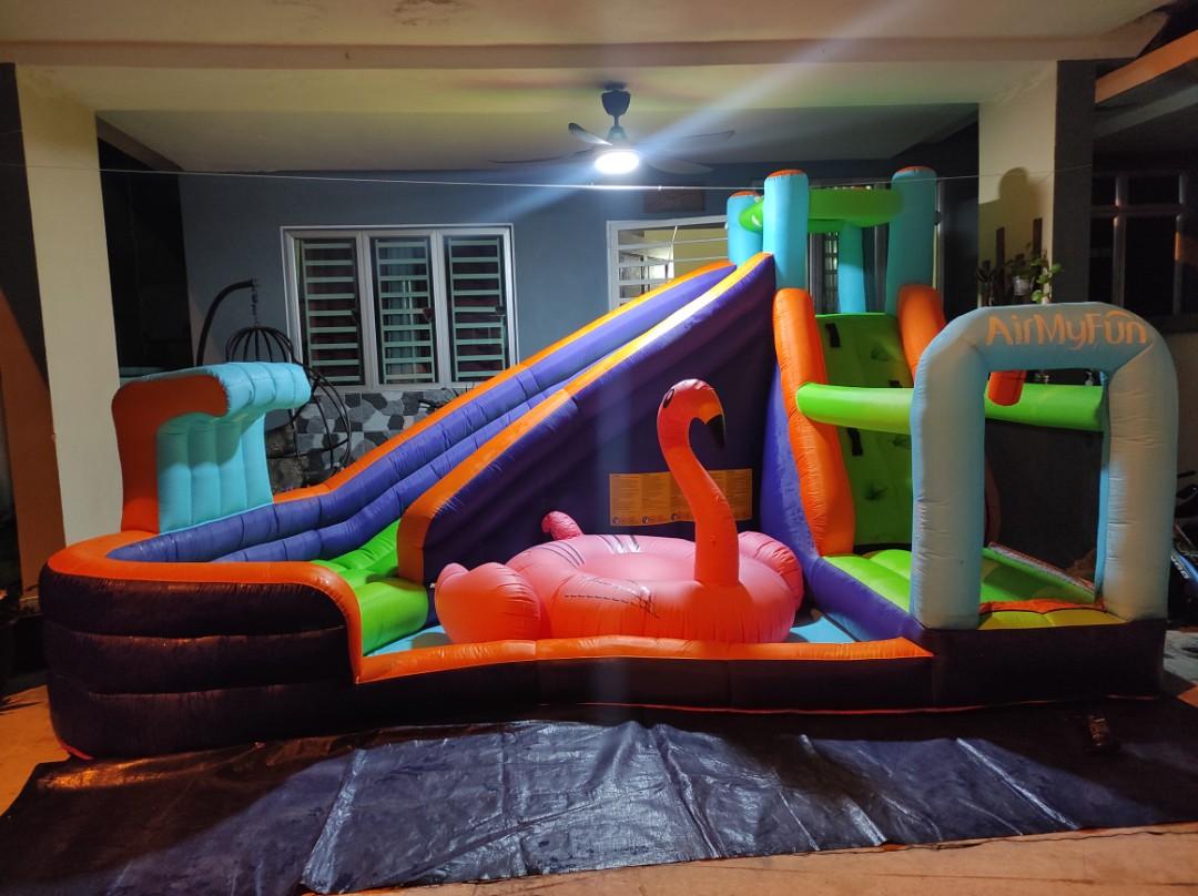 Inflatable clearance bouncer slide