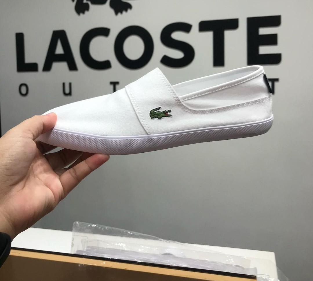 Lacoste mens white slip ons best sale