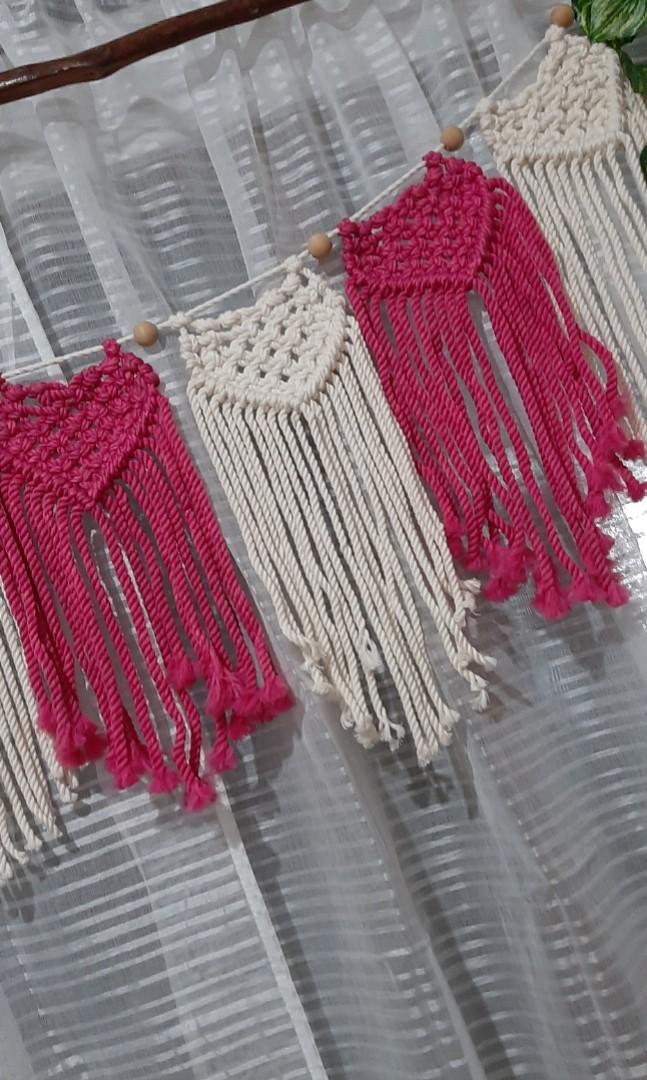 Macrame heart bunting (Category: Wall Decor) located in Binan City. Submitted by relizas_modern_macrame (Listing ID 1138546416, Image 3). Description: available best for valentine events home or room decoration 14x38cm size per bunting 180pesos per bunting creamy white and fuschia pink on the photo.