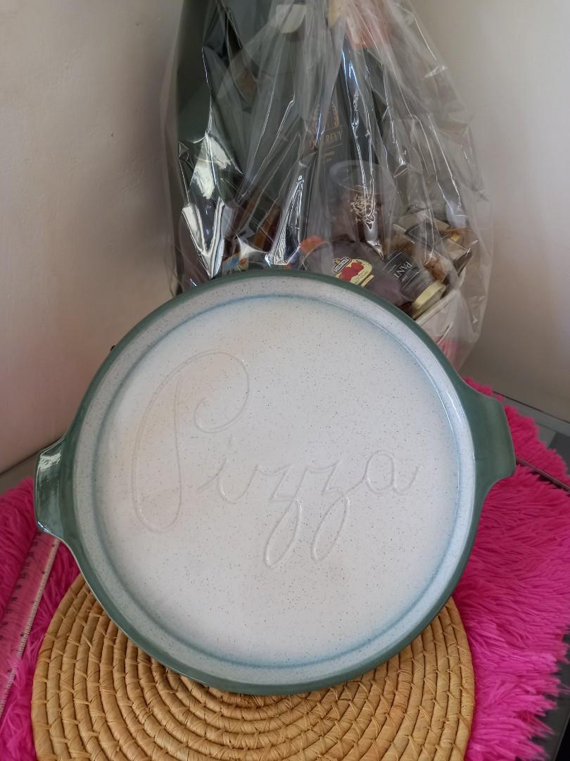 STONEWARE PIZZA SERVING PLATE (Category: Bakeware) located in Cavite. Submitted by qapirazzo_voutik23 (Listing ID 1138505165, Image 2). Description: STONEWARE PIZZA SERVING PLATE / DISH - MOIRA OF CHESTERFIELD - OVEN TO TABLE 12 INCHES IN DIAMETER 14 INCHES WITH HANDLE.