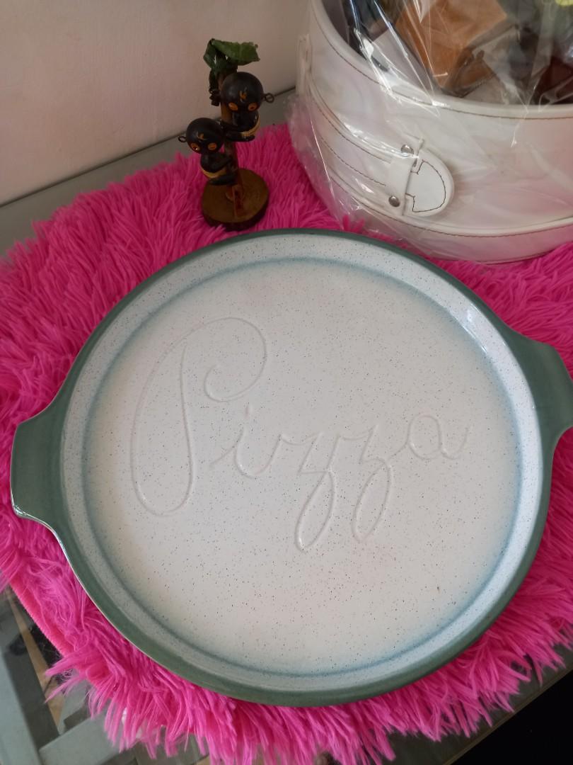 STONEWARE PIZZA SERVING PLATE (Category: Bakeware) located in Cavite. Submitted by qapirazzo_voutik23 (Listing ID 1138505165, Image 1). Description: STONEWARE PIZZA SERVING PLATE / DISH - MOIRA OF CHESTERFIELD - OVEN TO TABLE 12 INCHES IN DIAMETER 14 INCHES WITH HANDLE.