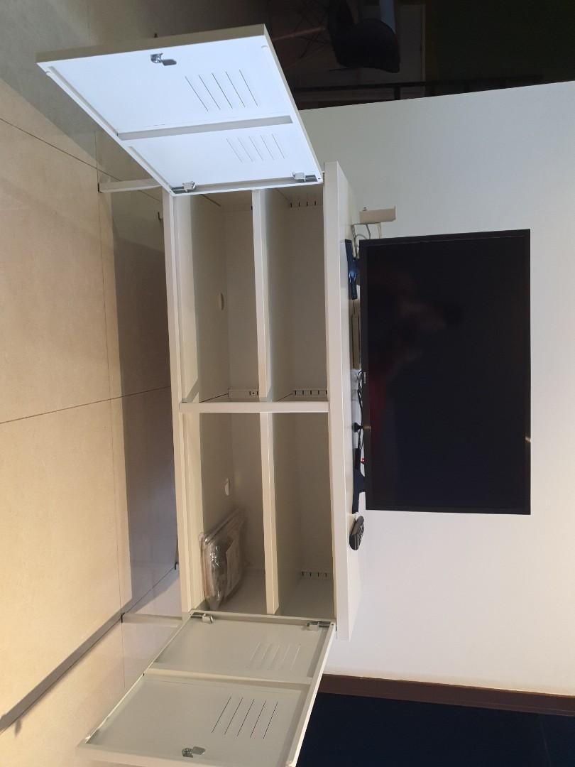 TV shelf (Category: Shelves, Cabinets & Racks) located in Singapore. Submitted by ibn (Listing ID 1134929607, Image 3). Description: L 118 x W 40 x H 63 As new, metallic white, self collection..