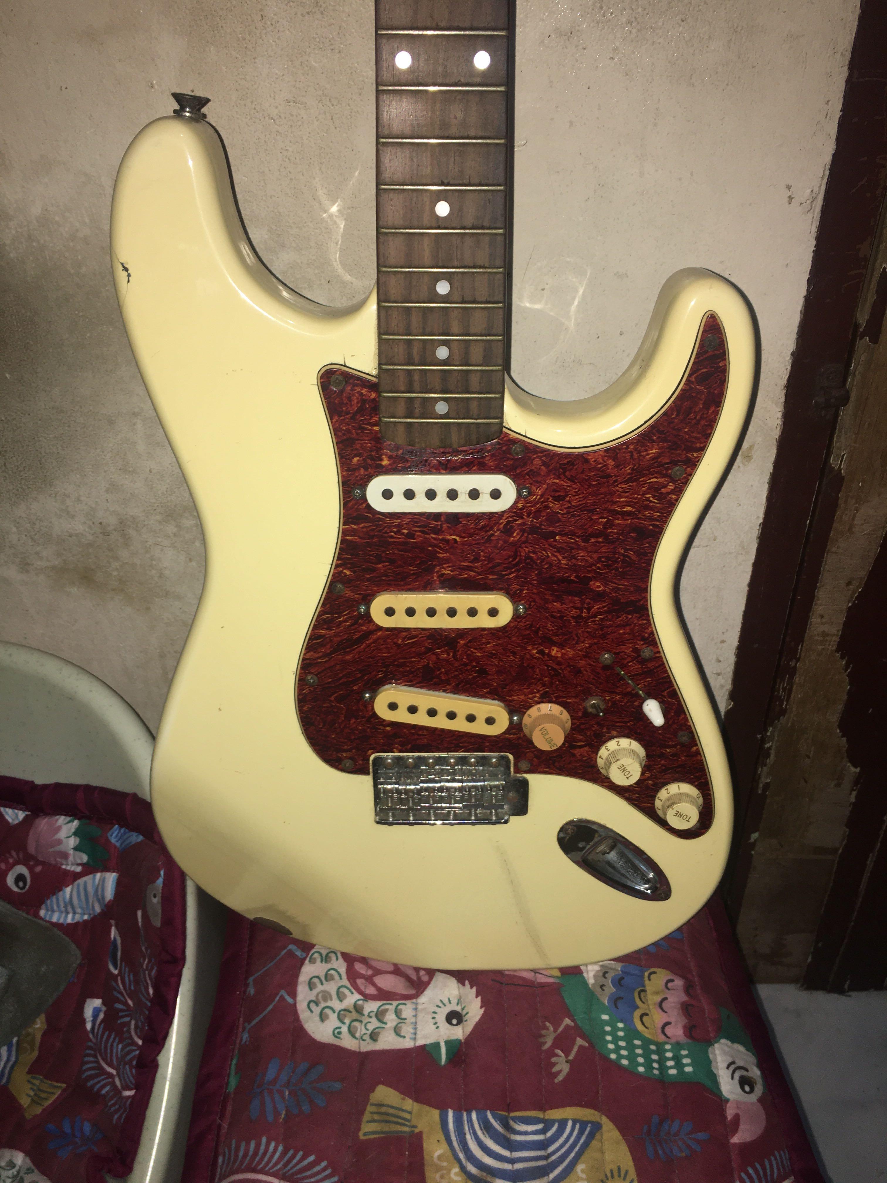 Fender Statocaster MIK 1993 with fender hardcase (Category: Musical Instruments) located in Quezon City. Submitted by neverfoundland (Listing ID 1116442585, Image 2). Description: Rare Fender stratocaster made in Korea. 1993 serial no.Heavily used in gig by the former owner.Modded a lot for various application. Old but heavy sounding guitar. Includes original Fender hardcase Asking price 30k negotiable..