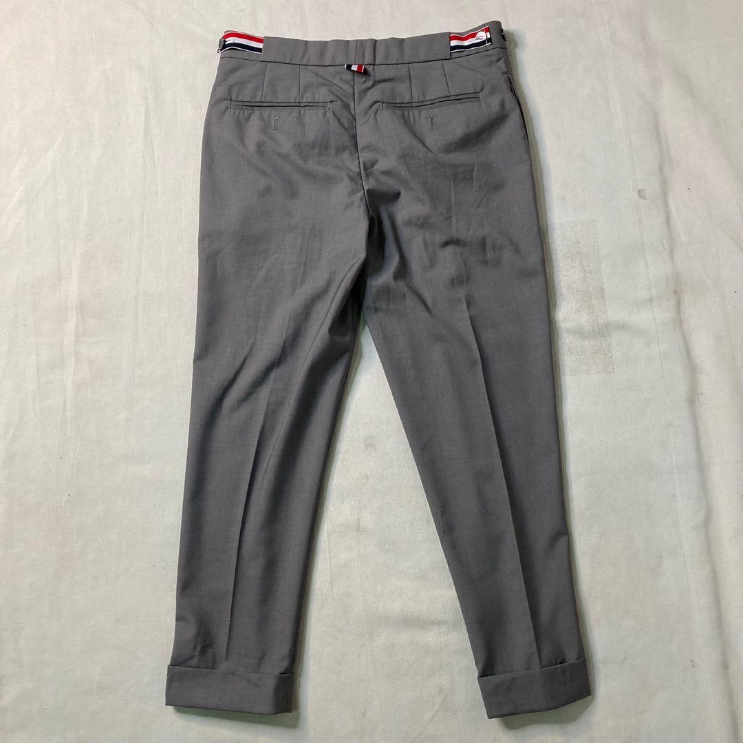 Thom Browne grey cuffed hem cotton trouser pants (Category: Trousers) located in Baguio. Submitted by jimbles_28 (Listing ID 1138694152, Image 2). Description: Dimes: Tagged size 2 waist 31 inches inseam 26.5 inches leg opening 6.75 inches *Issues- back button snapped in half, but still can button well & a really small stain Shipping will be shouldered by the buyer PM if you have more questions .