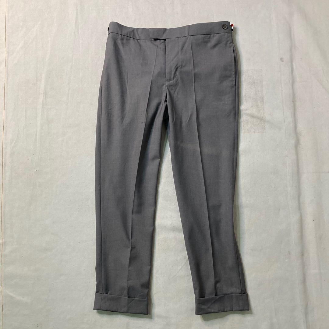Thom Browne grey cuffed hem cotton trouser pants (Category: Trousers) located in Baguio. Submitted by jimbles_28 (Listing ID 1138694152, Image 1). Description: Dimes: Tagged size 2 waist 31 inches inseam 26.5 inches leg opening 6.75 inches *Issues- back button snapped in half, but still can button well & a really small stain Shipping will be shouldered by the buyer PM if you have more questions .