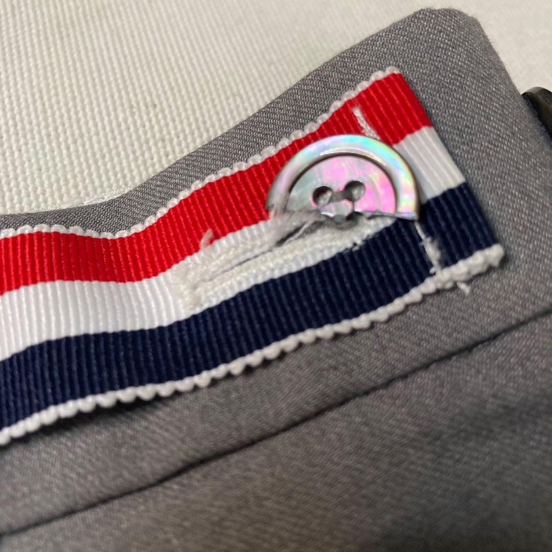 Thom Browne grey cuffed hem cotton trouser pants (Category: Trousers) located in Baguio. Submitted by jimbles_28 (Listing ID 1138694152, Image 3). Description: Dimes: Tagged size 2 waist 31 inches inseam 26.5 inches leg opening 6.75 inches *Issues- back button snapped in half, but still can button well & a really small stain Shipping will be shouldered by the buyer PM if you have more questions .
