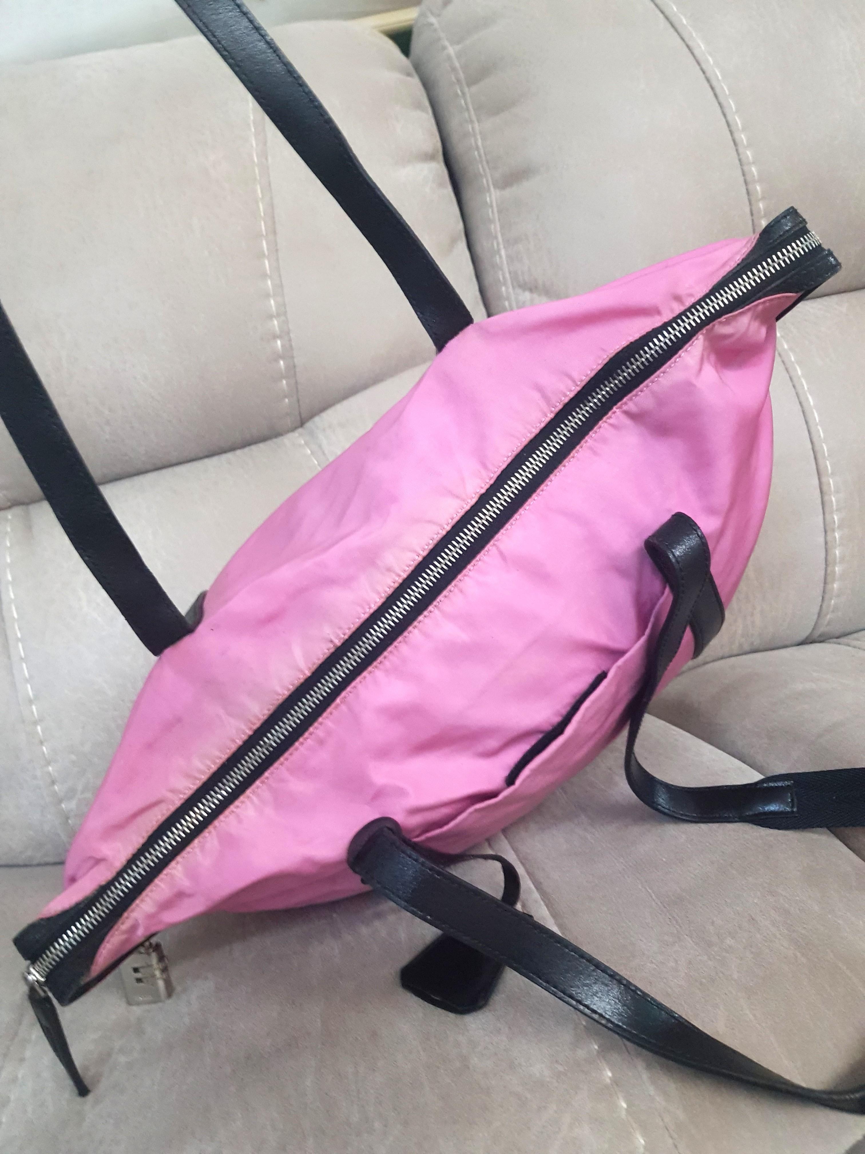 Authentic Prada Nylon Tote Bag (Category: Luxury Bags & Wallets) located in Antipolo. Submitted by dlolin (Listing ID 1138923038, Image 2). Description: Authentic💢 Will ignore low ballers and maarte Discoloration on nylon Corners inside needs to be sewn Forgot the lock combination Usable pagandahin niyo na lang 🙂.