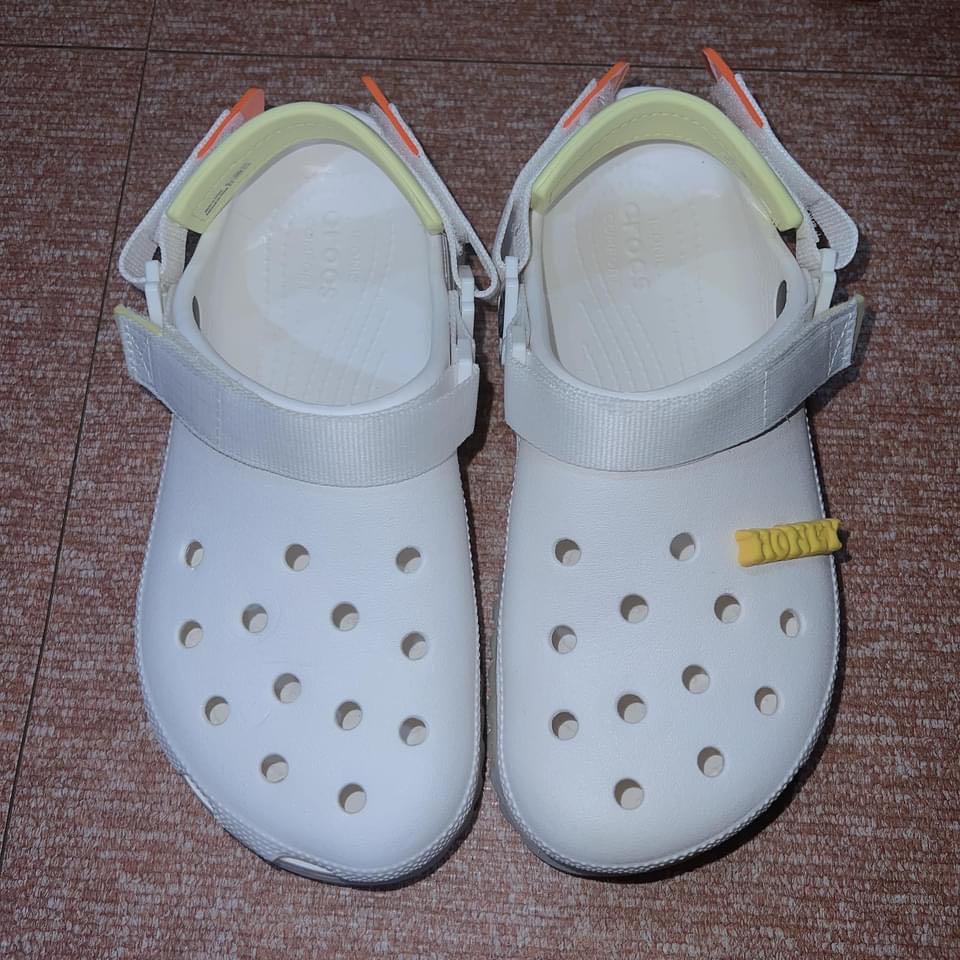 White crocs shop with green strap
